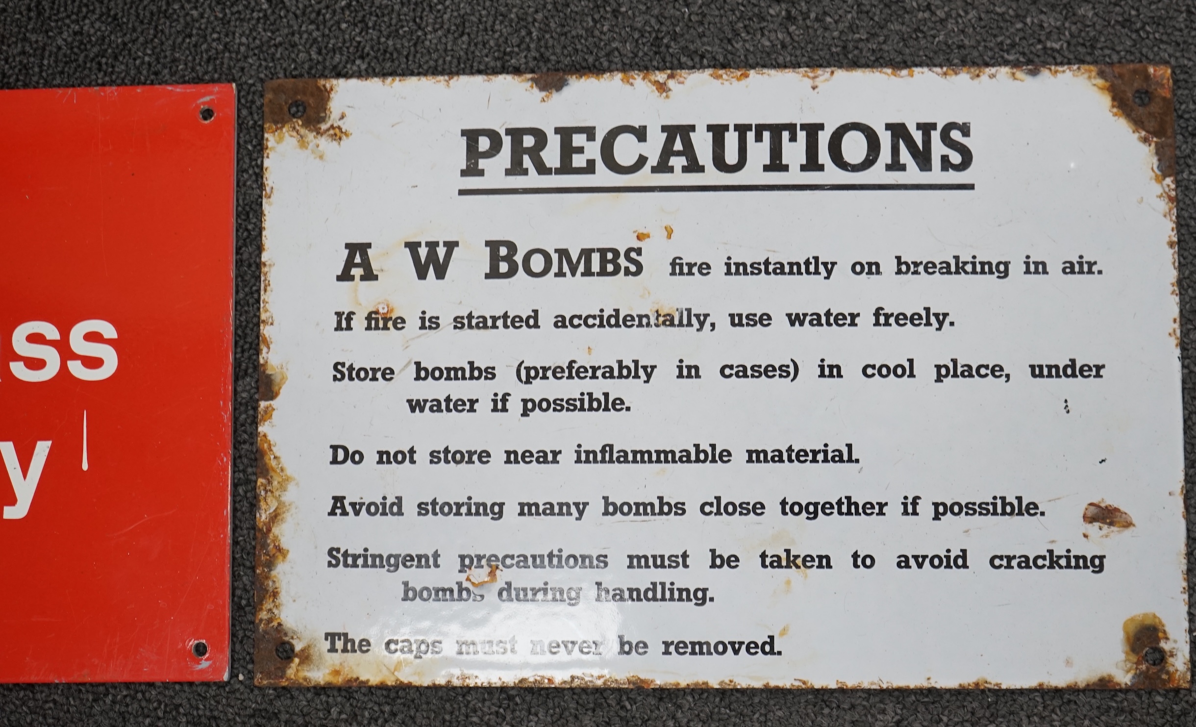 A Great Northern Railway cast iron sign; Trespassers Will Be Prosecuted, 28.5cm x 57cm, together with a WWII A W Bombs Precautions enamelled sign, a Margarine tin sign, a plastic BR Warning sign and a BR enamelled DANGER